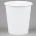 A Bare by Solo wax treated white paper cold cup on a gray surface.