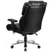 A black Flash Furniture office chair with wheels and armrests on a white background.