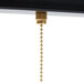 A gold chain hanging from a black Aarco Cerveza LED sign.