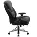 A Flash Furniture black leather office chair with armrests.