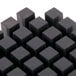 A close-up of a black cube with Nemco 55418 3/8" Push Block.