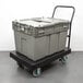 A grey plastic container on a Lavex heavy duty platform cart.