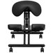 A black Flash Furniture kneeling office chair with wheels and a saddle seat.