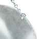 A close-up of a Cardinal Detecto metal scoop bowl with a chain attached.