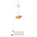 A Cardinal Detecto hanging scale with a metal scoop of oranges in a basket.