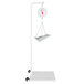 A Cardinal Detecto hanging scale with a white stand.