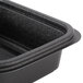 A close up of a black Genpak Smart-Set Pro rectangular plastic container with a lid.