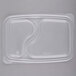 A clear plastic rectangular lid with curved sides.