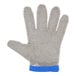 A close up of a San Jamar stainless steel mesh glove with a blue handle.