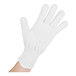 A hand wearing a San Jamar white cut resistant glove.