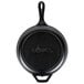 A Lodge pre-seasoned cast iron combo cooker with a black cast iron skillet and white background.