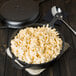 A Lodge cast iron skillet with macaroni and cheese.