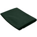 A folded hunter green rectangular cloth table cover.