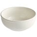 An Acopa ivory stoneware bowl with a rolled edge on a white surface.
