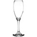 A close-up of a clear Libbey Teardrop wine glass with a long stem.