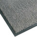 A close-up of a gunmetal grey carpet with black trim.