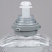 A close up of a Purell hand sanitizer bottle with a white plastic cap.