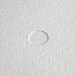 A white circular piece of Pitco filter paper with a hole in the center.