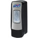 A Purell ADX foaming hand sanitizer dispenser on a wall.