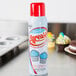 A close up of a Baker's Sprease baking release spray can with a red cap.