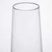 A clear plastic stemless flute with a clear rim.