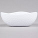 A white GET Coralline melamine triangle bowl with a pattern.
