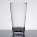 A close-up of a clear GET Tritan plastic tumbler on a table.