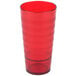 A red plastic tumbler with a stripe design.