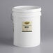 A white Golden Barrel 5 gallon bucket of coconut oil with a label.