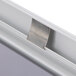 A close-up of a satin aluminum snap frame on a white surface.