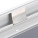 A close-up of an Aarco satin aluminum snap frame on a white wall.