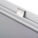 A close-up of a satin aluminum silver snap frame on a white wall.