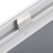 A close-up of a silver aluminum snap frame with round corners.