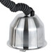 A stainless steel bell with a black cord hanging from it.