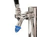 A San Jamar beer tap with a blue plastic cap.