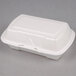 A white Genpak foam hinged lid container.