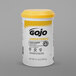 A white container of GOJO Lemon Pumice Hand Cleaner with a yellow lid and black text.