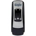A black and silver GOJO® ADX-7 soap dispenser with a black cover.