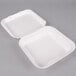 Two white Genpak foam containers with hinged lids.