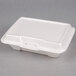 A white Genpak styrofoam hinged lid container.