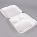 A white Genpak styrofoam container with 3 compartments and a hinged lid.