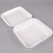 Two white Genpak styrofoam containers with hinged lids.