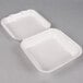 Two Genpak white styrofoam containers with hinged lids.