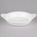A white bowl with handles.
