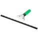 A Unger ErgoTec window squeegee with a green and black handle.