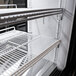 A white Turbo Air dual dry and refrigerated bakery display case with shelves inside.