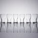 A row of six Libbey Mini Pub Tasting Glasses on a table.