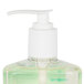 A bottle of Micrell floral hand soap with a green pump.
