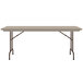 A Correll mocha granite rectangular folding table with metal legs.