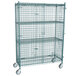A Regency wire security cage kit with wheels and three shelves in green.